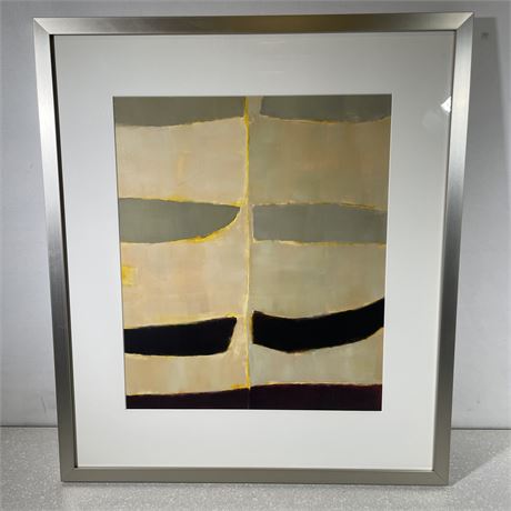Framed green, white, yellow, tan and black abstract art print with a white mat and a chrome metal frame